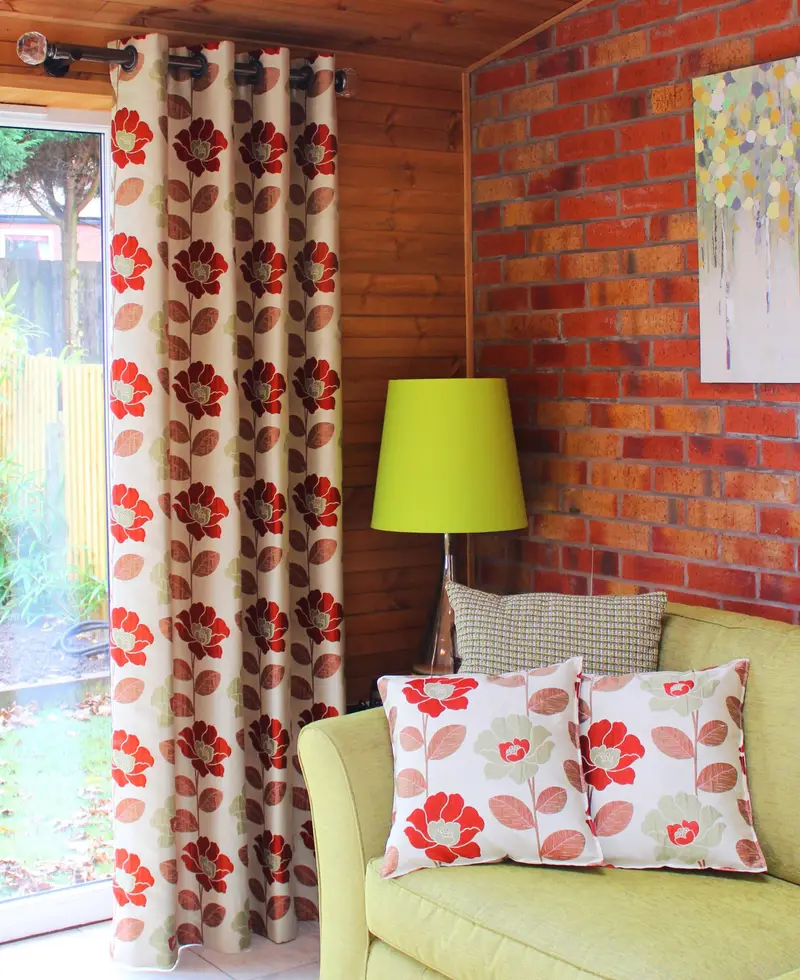 Floral eyelet curtains with matching cushions by Heather Horrocks Leigh