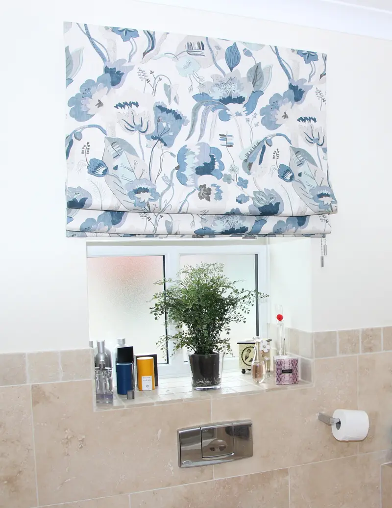 Floral Roman blind in a bathroom by Heather Horrocks Leigh