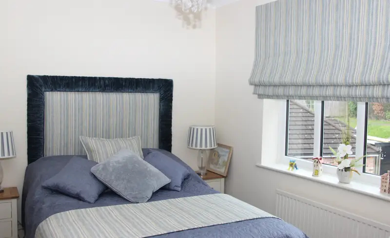 Striped Roman blind with matching headboard by Heather Horrocks Leigh